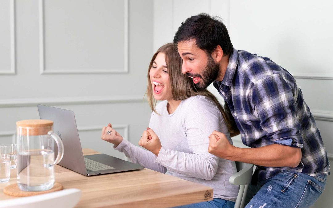 happy couple getting pre-approved for their mortgage in alberta